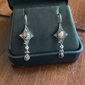 Sterling silver dangling black star earrings